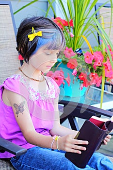 Little yuppie girl reading bible photo