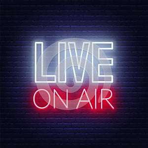 Live on air neon glowing sign on a dark background.