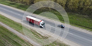 Live animal transport truck move on road aerial view