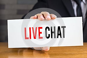 Live chat, message on white card and hold by