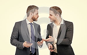 live communication. two colleagues discussing business hold phone. businessmen business conversation