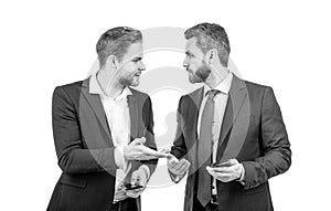 live communication. two colleagues discussing business hold phone. businessmen business conversation