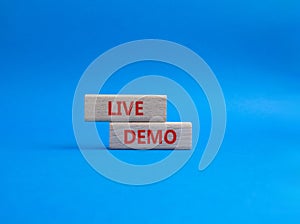 Live Demo symbol. Concept word Live Demo on wooden blocks. Beautiful blue background. Business and Live Demo concept. Copy space