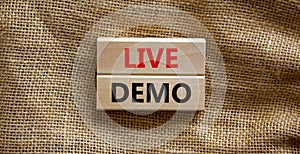 Live demo symbol. Concept words `live demo` on wooden blocks on a beautiful canvas background. Copy space. Business and live dem