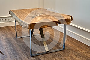Live edge elm slab coffee table. Woodworking and carpentry production. Furniture manufacture