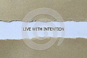 live with intention on white paper photo