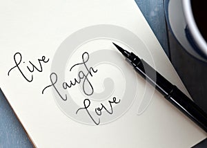LIVE LAUGH LOVE hand-lettered in notepad