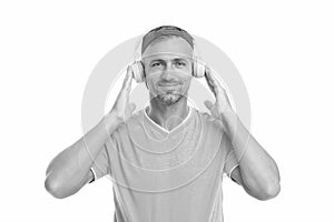 Live life loud. Handsome guy wear headset isolated on white. Mature man listen to music in headset. Stereo headset