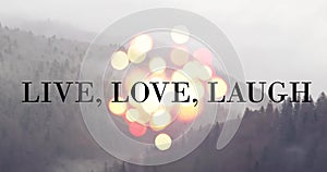 Live love laugh - inspirational message on mountain landscape backdrop