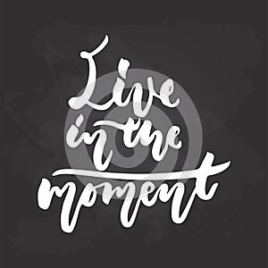 Live in the moment - hand drawn Summer seasons holiday lettering phrase isolated on the white background. Fun brush ink