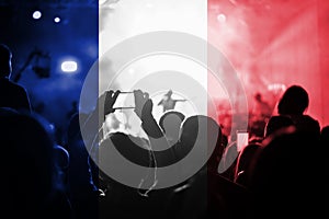 Live music concert with blending France flag on fans