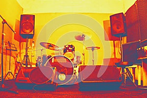 Live music photo background, rock drum set with and blurred stage lights. Thermography gradients, retro glitch, noise