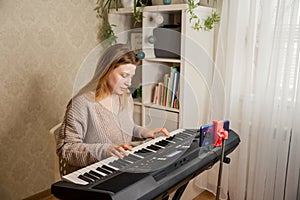 Live streaming concert. Teacher teaching to play piano online.