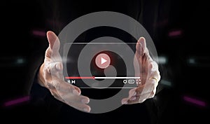 Live video marketing concept. Businessman hand holding transparent screen and tuching on start button to run video clip