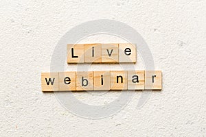live webinar word written on wood block. live webinar text on cement table for your desing, concept