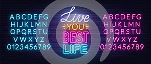 Live You Best Life neon lettering on brick wall background.