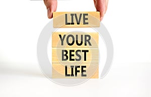 Live your best life symbol. Concept words Live your best life on wooden blocks. Beautiful white table white background.