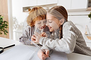 Lively admirable siblings sharing a drink