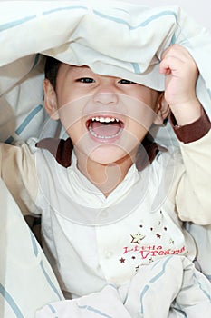 Lively asian boy laughing