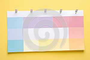 A lively image of a pink and yellow planner set against a vibrant bright blue background.