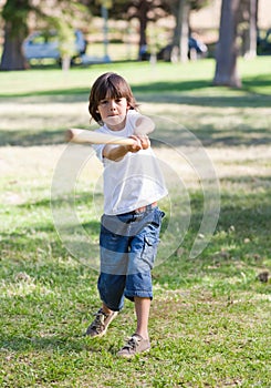 Lively little boy playing baseball