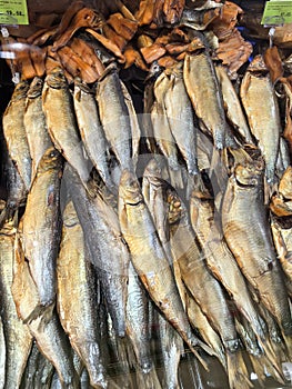 Smoked fish display in a bustling market showcasing vibrant local cuisine photo