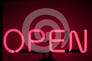 Lively Nights: Neon \'Open\' Sign Illuminating the Bar