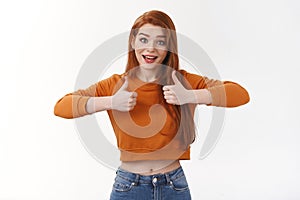 Lively supportive enthusiastic redhead european woman cheering show thumbs-up approval gesture liking excellent idea