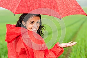 Lively teenager girl in the rain