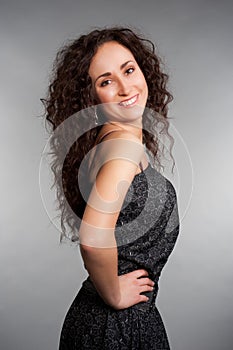 Lively woman with long curly hair