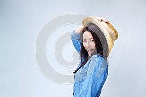 Lively young woman laughing with cowboy hat photo