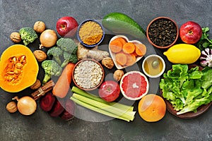 Liver detox diet food concept, fruits, vegetables, nuts, olive oil, garlic. Cleansing the body, healthy eating. Top view, flat lay