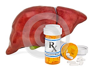 Liver and drugs concept. Human liver with medical bottles and pi