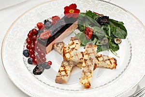 Liver foie gras with croutons and berries