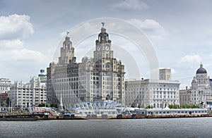 Liverpool, June 2014,  a scene across the River Mersey showing Pier Head, with the Royal Liver Building, Cunard Building and Port