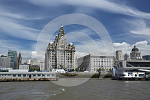 Liverpool, June 2014,  a scene across the River Mersey showing Pier Head, with the Royal Liver Building, Cunard Building and Port