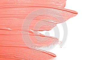 Living Coral colored smear of paint texture