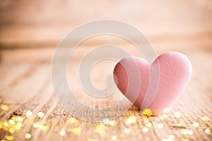 Living coral heart candy on a wooden background. Valentines day greating card