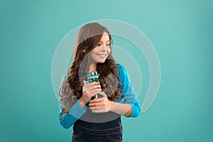 Living healthy life. Health and water balance. Girl hold water bottle blue background. Kid girl long hair has water
