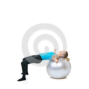 Living a healthy lifestyle. a woman balancing on an exercise ball with copyspace.