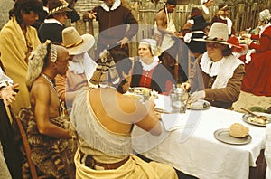 Living history reenactment of Pilgrims and Indians dining on Plymouth Plantation, Plymouth, MA