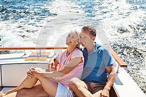 Living life in cruise control. a mature couple enjoying a relaxing boat ride.