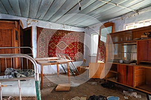 Living room of an abandoned house in North Ossetia. Russia.