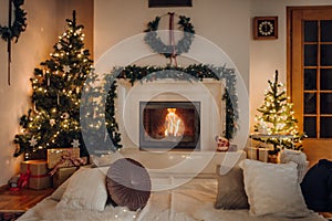 Living room with beautiful fireplace decorated for Christmas
