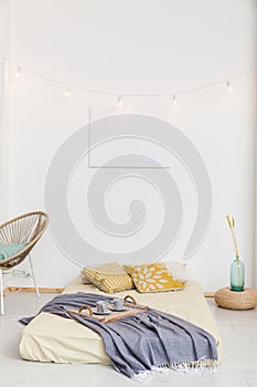 Living room with bed and white walls