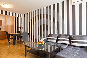 Living room with black and white striped walls