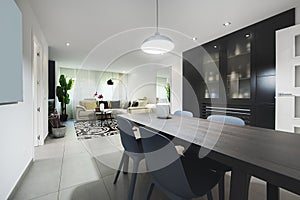 Living room with a black wooden bookcase and black and glass doors