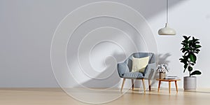 Living room with blue fabric armchair on empty white wall background.3d rendering