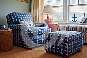 a living room with a blue ship-anchor patterned armchair and a matching ottoman