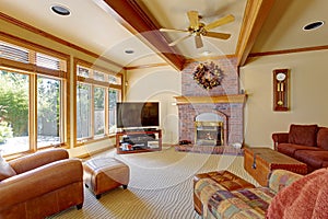 Living room with brick fireplace and ceiling beams